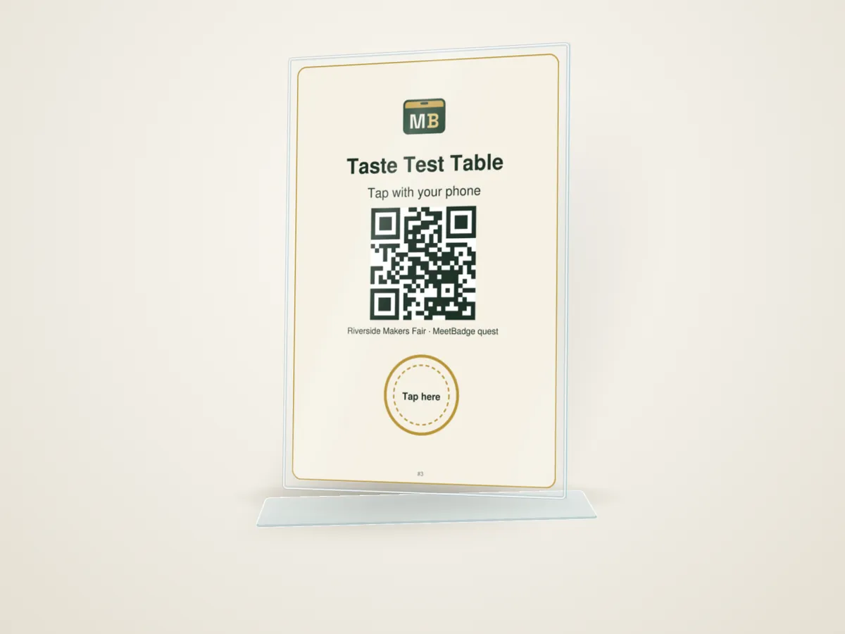 Quest Sign: a clear 4 by 6 inch acrylic stand-up holder with a printed insert reading "Taste Test Table", "Tap with your phone", a QR code and a gold "Tap here" ring over the tag